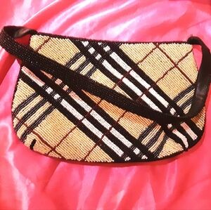 Excellent condition beaded purse. Approx length 13" inches. Snap close silk.